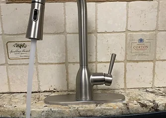 Installed kitchen faucet running water