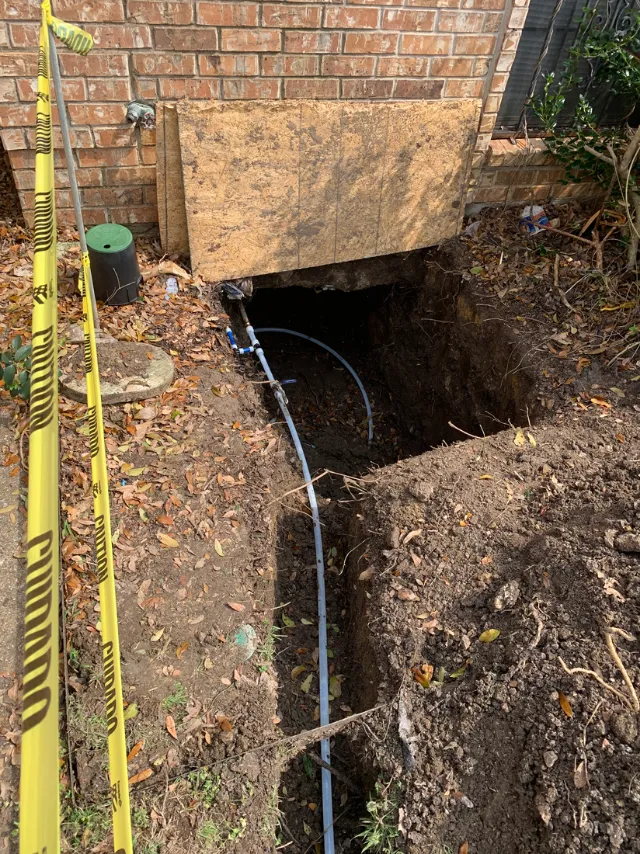 Exterior service line in an open trench